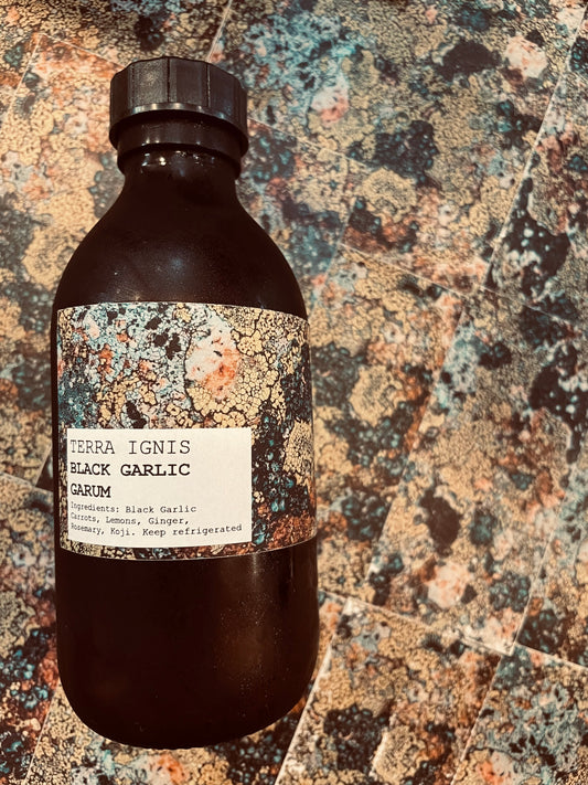 Bottle of black garlic garum made in Cork