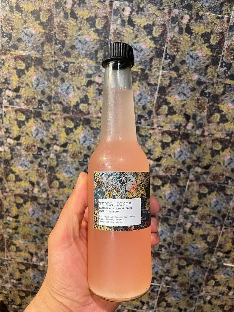 bottle of raspberry lemon verbena probiotic soda drink